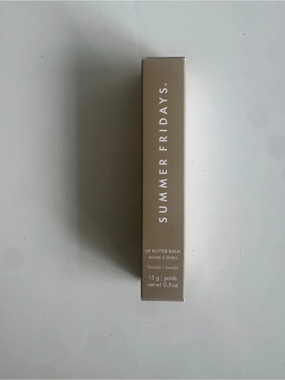 Summer Fridays Lip Butter Balm in beige and white packaging
